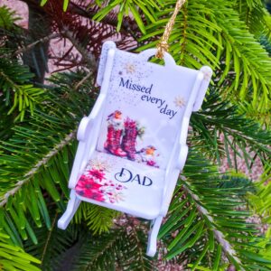 A Christmas boots memorial rocking chair ornament featuring a traditional festive red boots, gold snowflakes and Robins. Perfect to display on Christmas tree or graves this year.