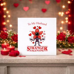Stranger Things Valentines Day card. Featuring a Demogorgon looking like a flower and with Valentine's lights and red hearts. Personalise with a message above the design.